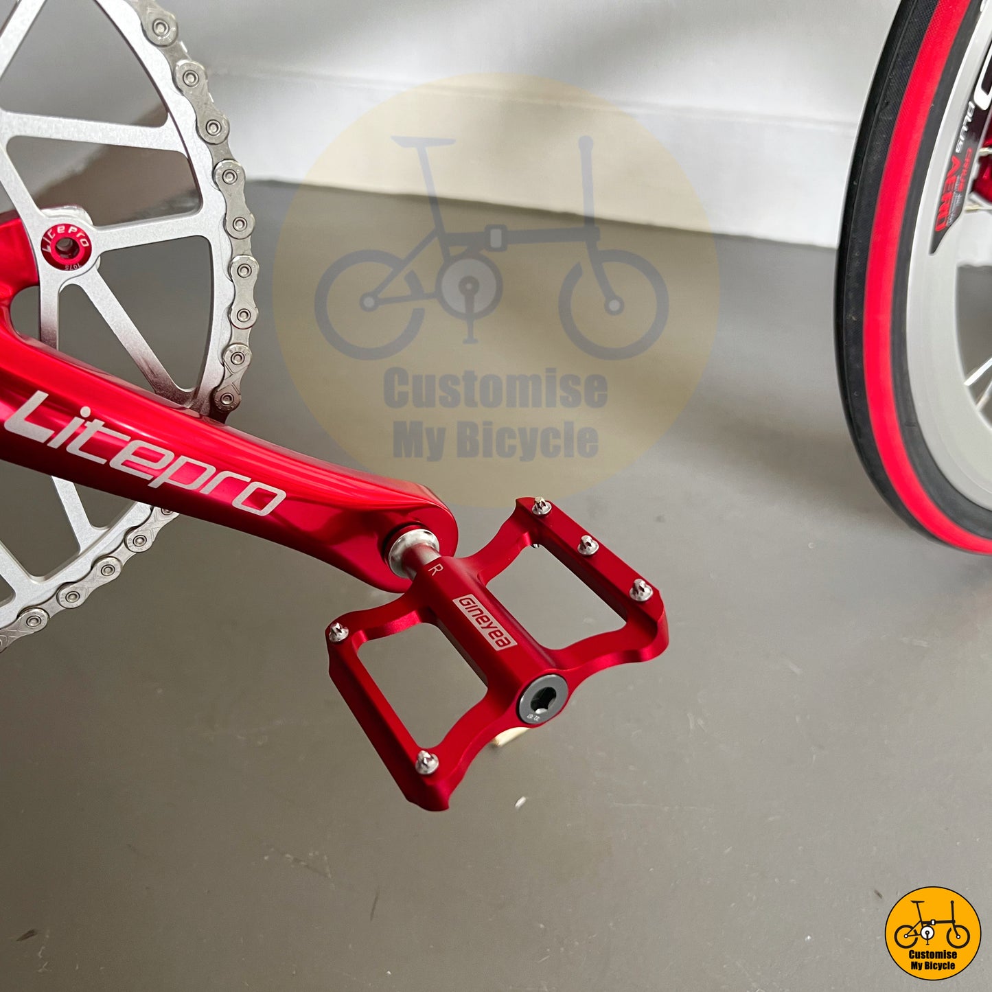 Red Gineyea Pedals on Crius Master 22-Inch Folding Bike β A High-Quality Ride for Daily Commutes