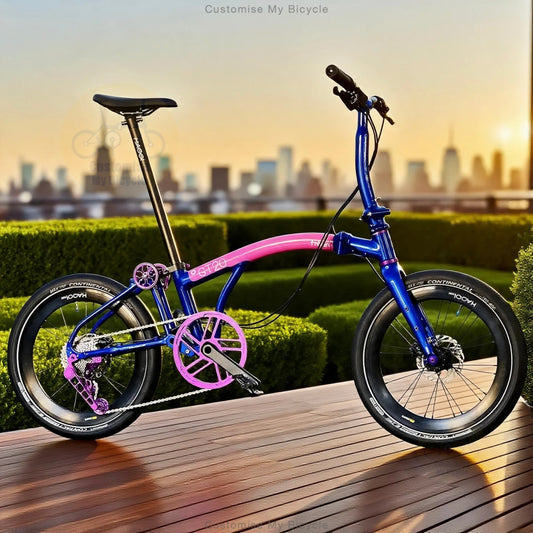 A compact folding bicycle with a metallic blue frame and bright pink accents, parked on a wooden deck with a blurred city skyline and hedges in the background.
