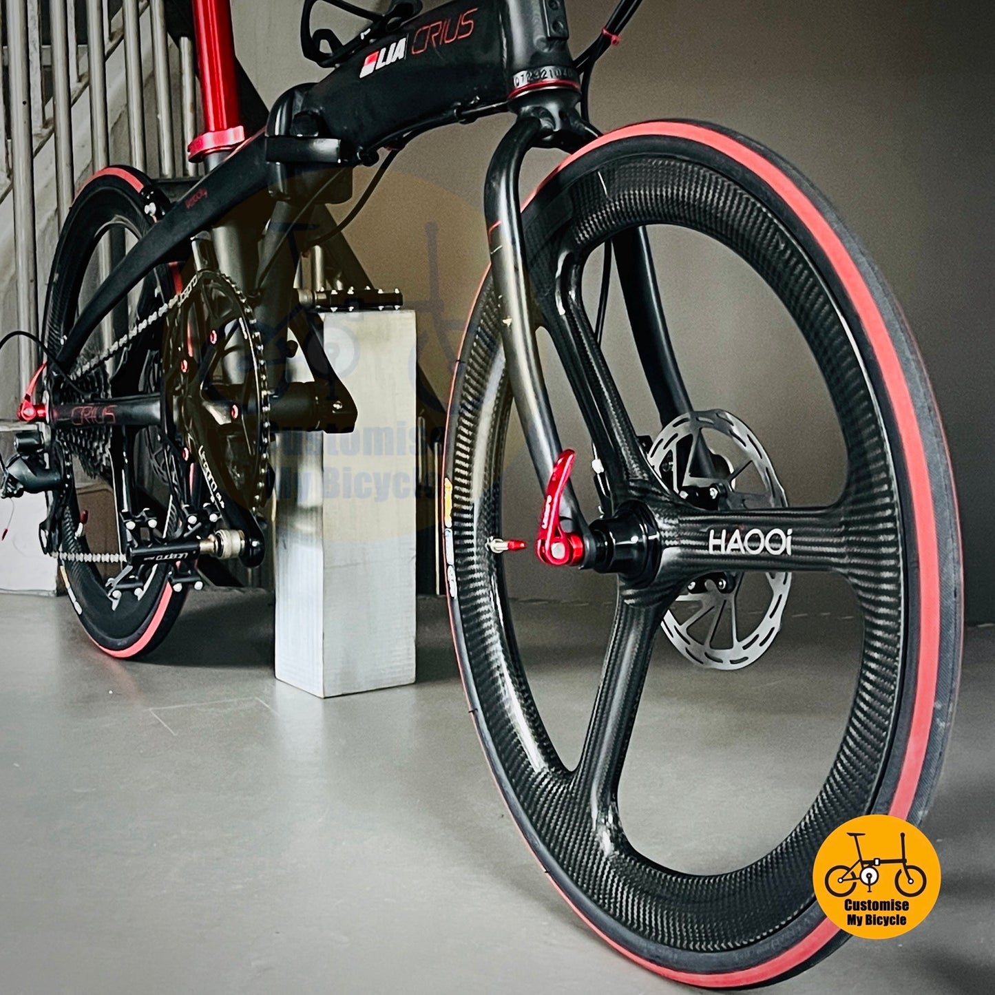 CST speedway tyres mounted on black and red 22 inch folding bike  
