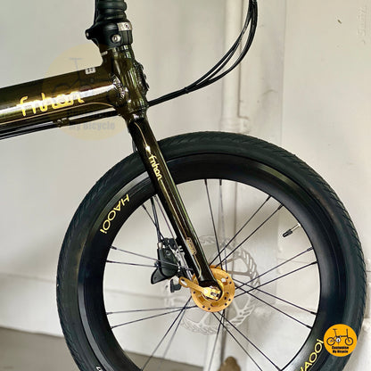 Close up of front wheel black gold HAOOI aero profile rim with CST tyre details
