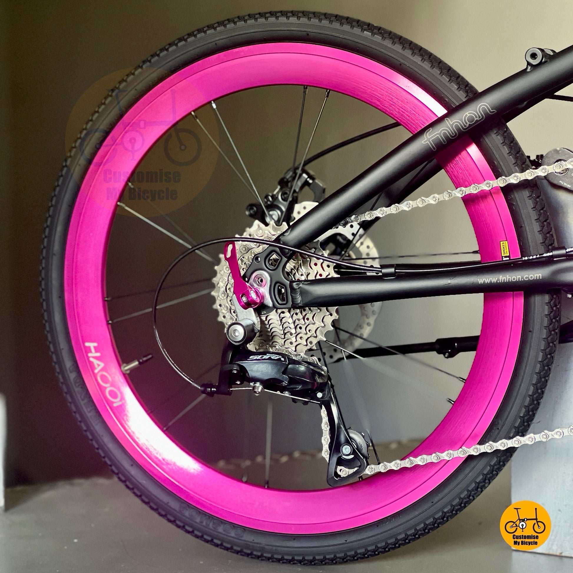 Matte black frame with hot pink components
