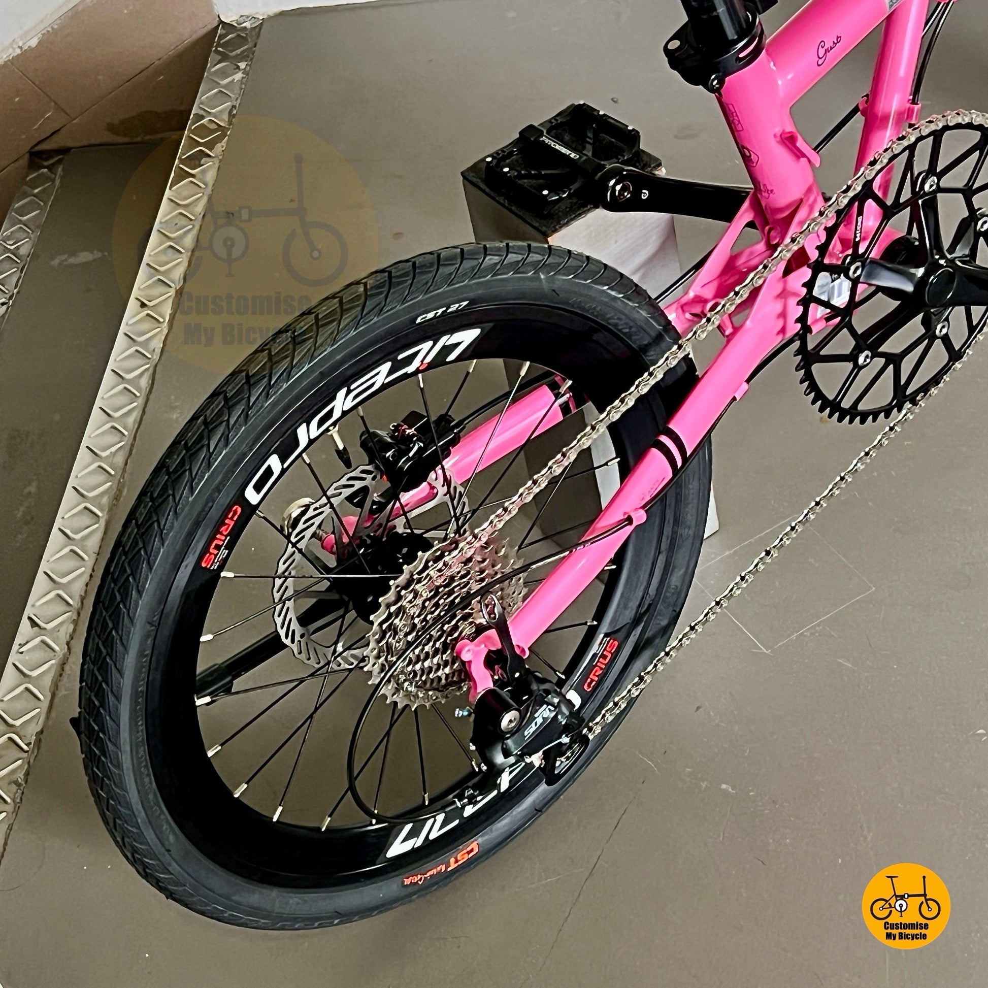 Close up of Shimano Tiagra 10 gears on Fnhon Gust hot pink folding bicycle
