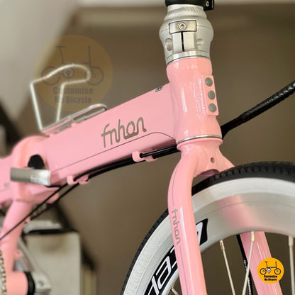 Baby pink folding bike front angle view Litepro aero wheels white wall tyres
