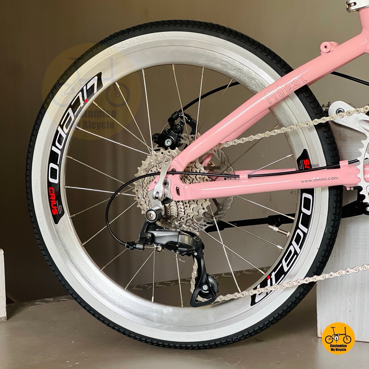 Close up Shimano 9 gears drivetrain folding bike cassette and derailleur detail
