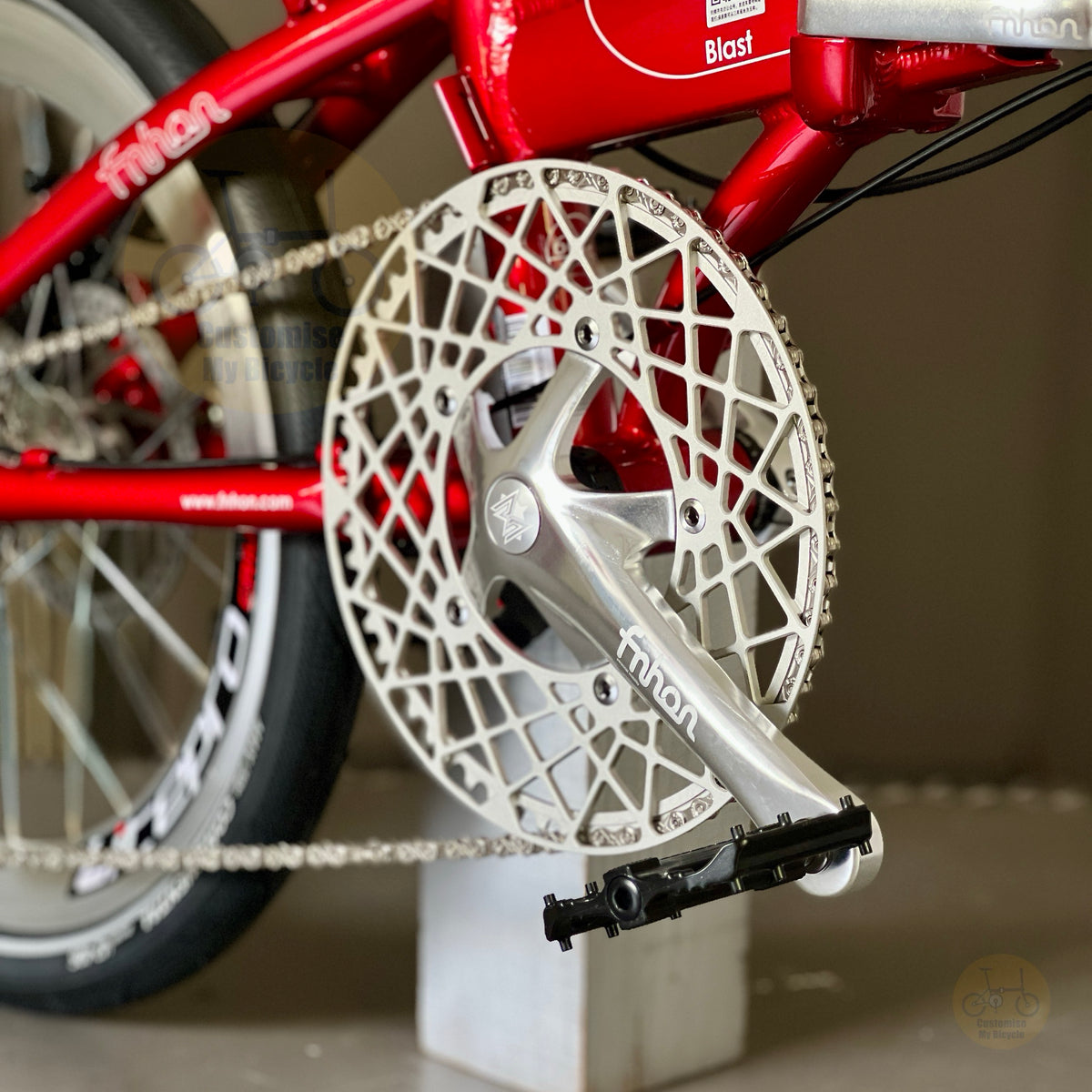Fnhon Blast Ruby Red folding bike close up of FNHON 54t Hollowtech crankset chainring crank arms and Shimano 9 speed drivetrain