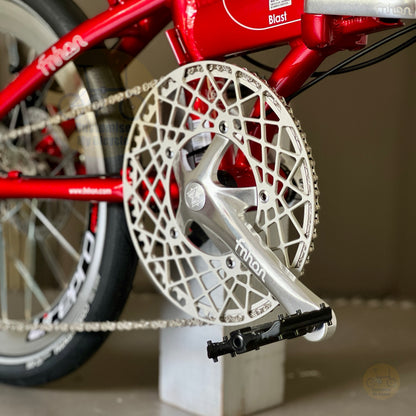 Fnhon Blast Ruby Red folding bike close up of FNHON 54t Hollowtech crankset chainring crank arms and Shimano 9 speed drivetrain