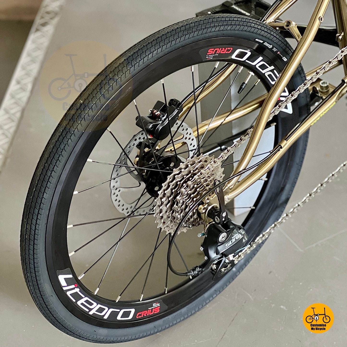 Close up of Shimano 9 speed rear derailleur and Maxxis 451 tyres on Fnhon Gust chromoly frame
