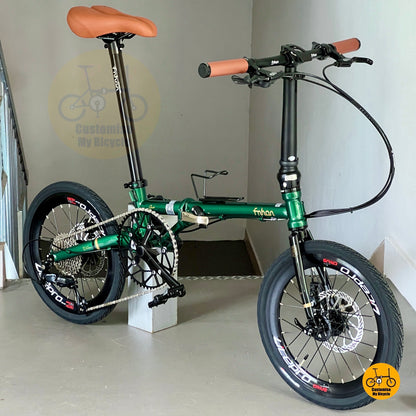 Angled view of Fnhon Gust 18-inch emerald green foldie with brown wall tyres and adjustable handlepost