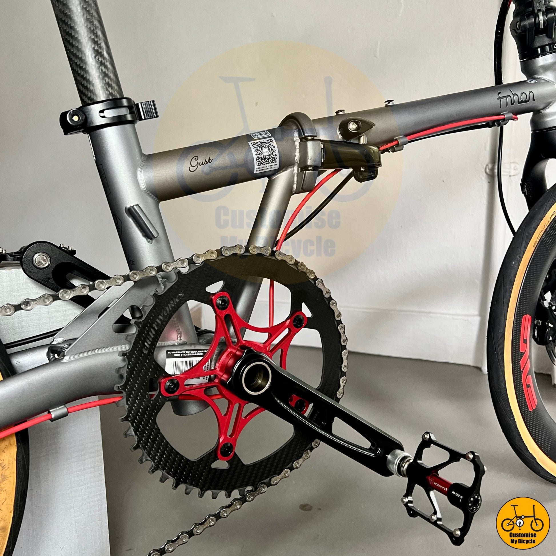 Carbon chainring on high-performance folding bike with aerodynamic carbon wheels
