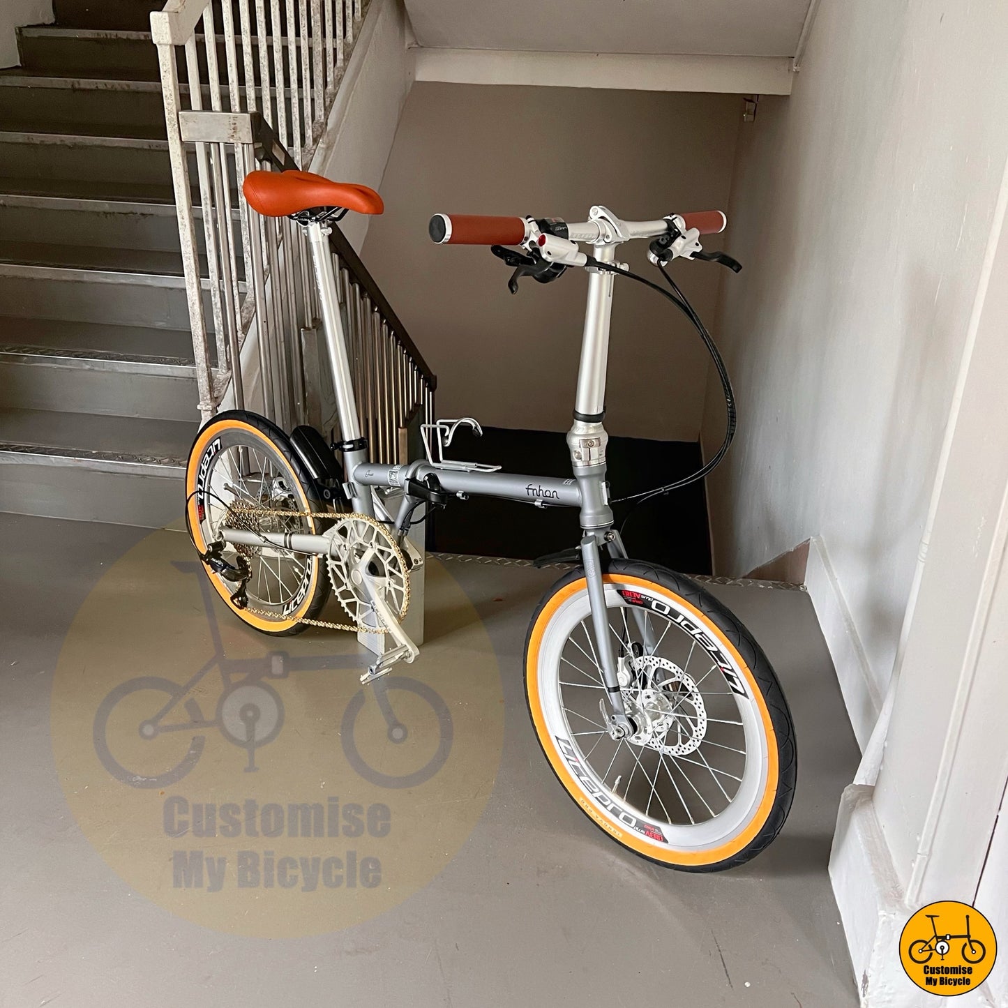 Folding bike with retro themed silver and brown parts  
