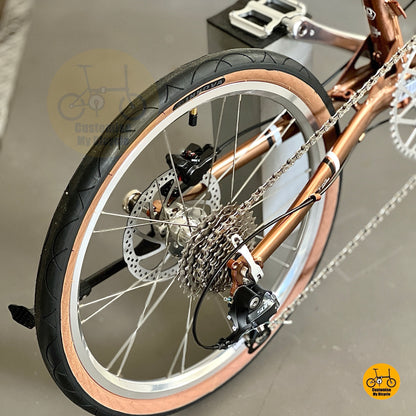 Close up of Shimano 9 speed rear derailleur on rose gold chromoly frame
