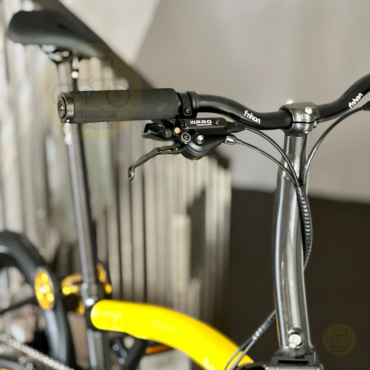 Fnhon GT20 Bumblebee 20 inch trifold foldable bicycle front three quarter view with yellow frame premium wheelset hydraulic disc brakes and compact folding design
