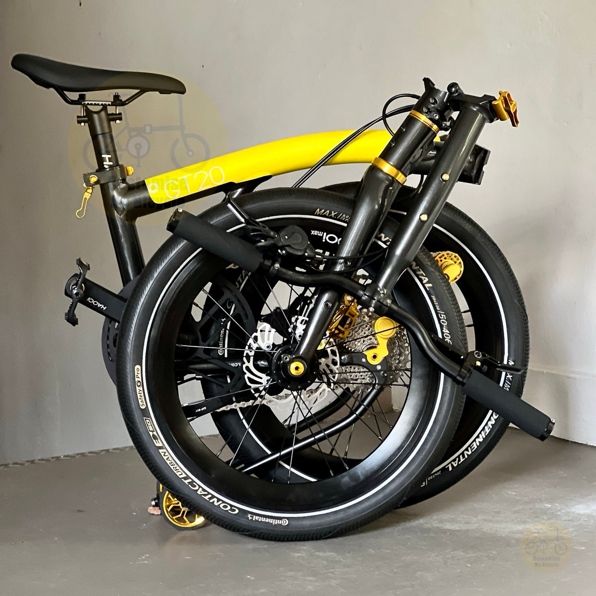 Fnhon GT20 Bumblebee 20 inch folding bicycle folded compactly showing the trifold design compact frame and easy transport configuration

