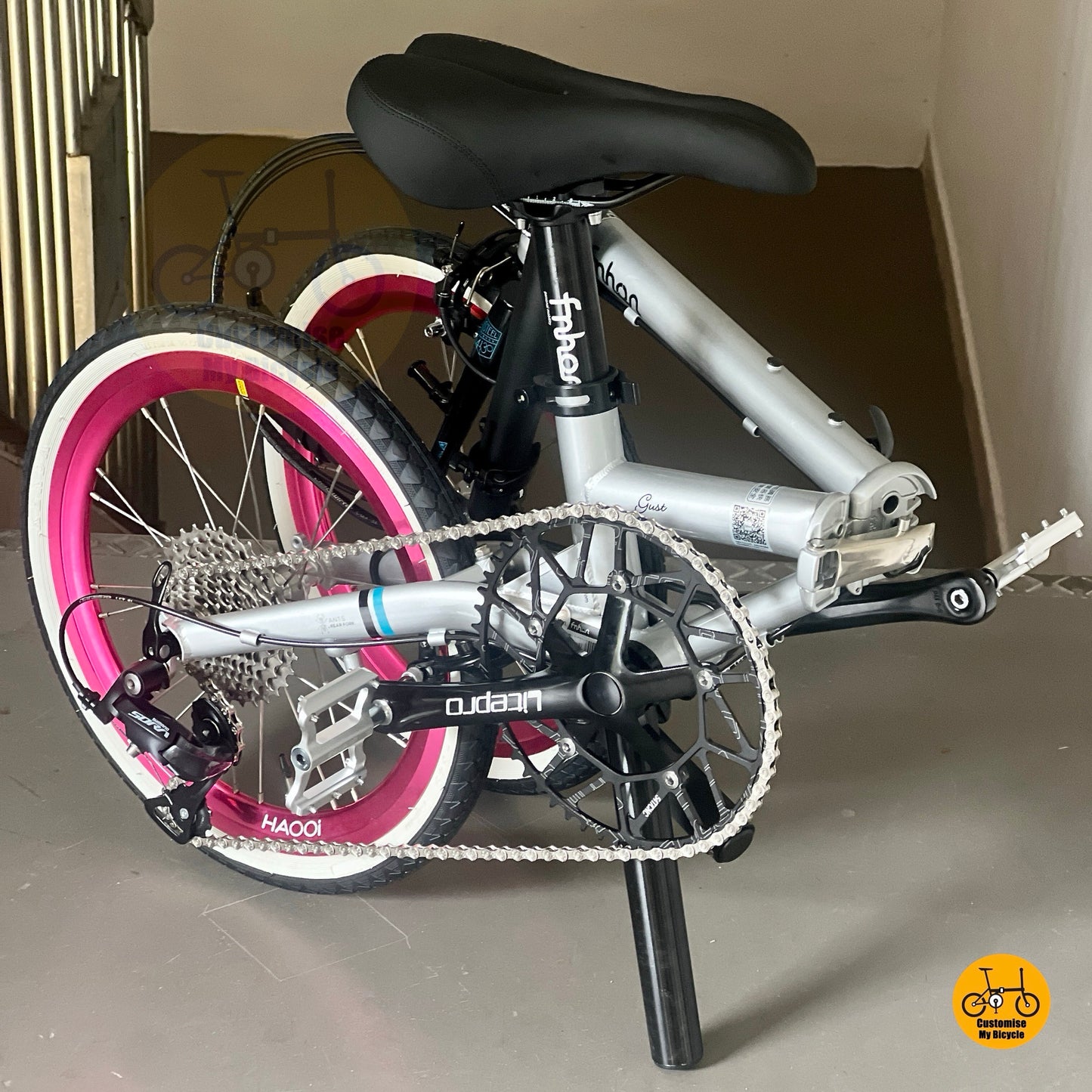 Full outdoor lifestyle photo of Fnhon Gust 18 inch dolphin grey hot pink folding bike
