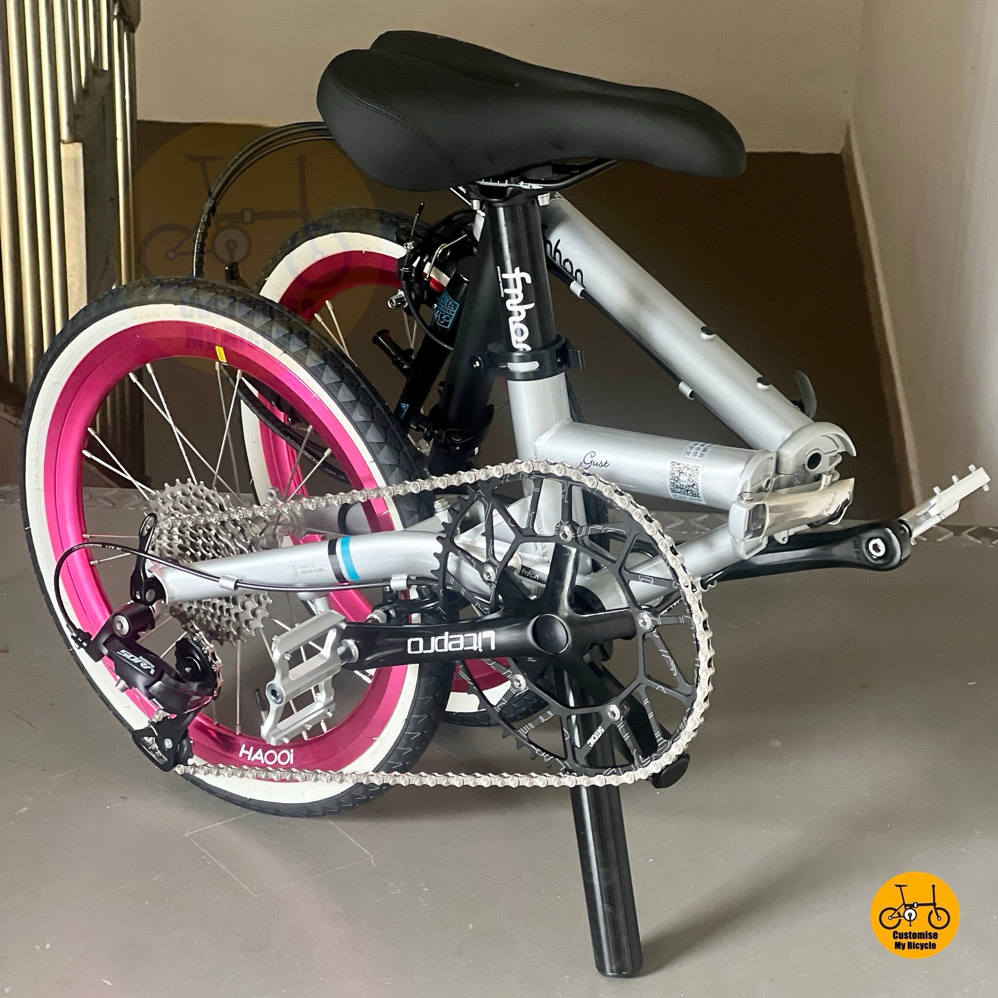 Full outdoor lifestyle photo of Fnhon Gust 18 inch dolphin grey hot pink folding bike
