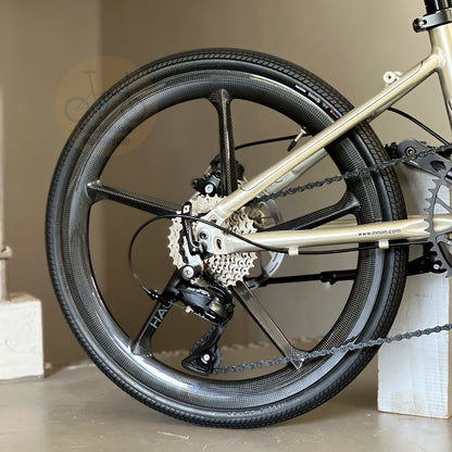 Fnhon Monsoon 22" Titanium Champagne folding bike in compact folded configuration