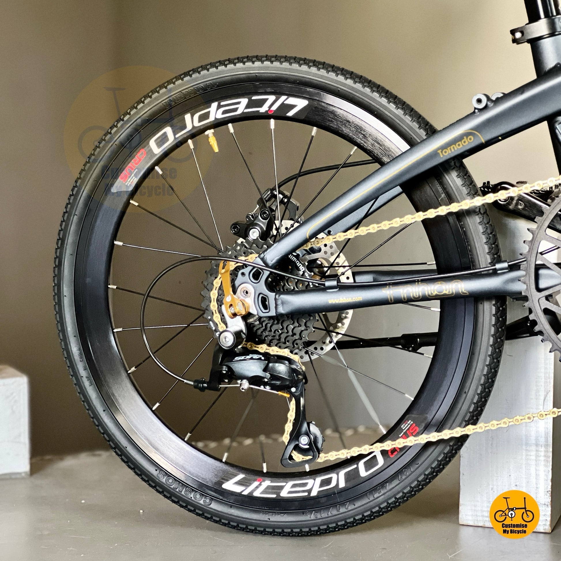 Shimano 9 speed folding bike with gold trim  
