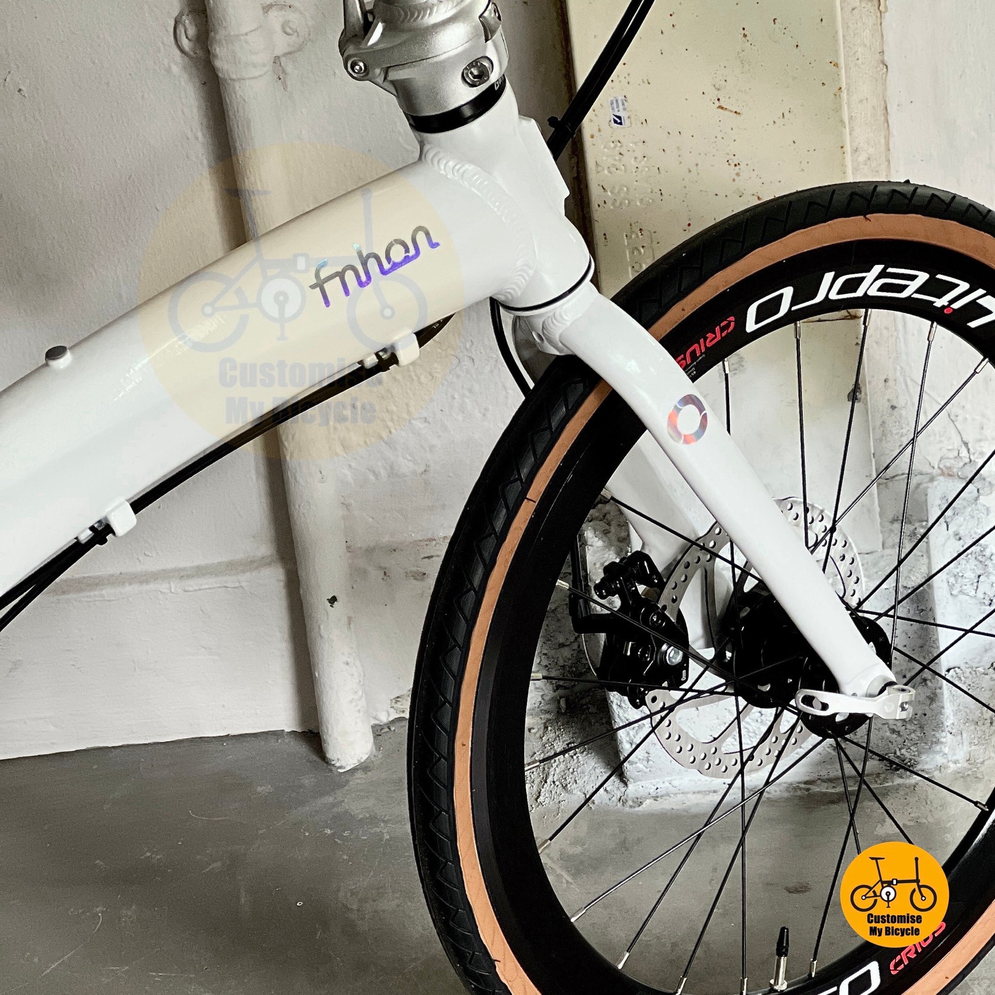 Fnhon Tornado folding bicycle low angle front view dreamy white frame

