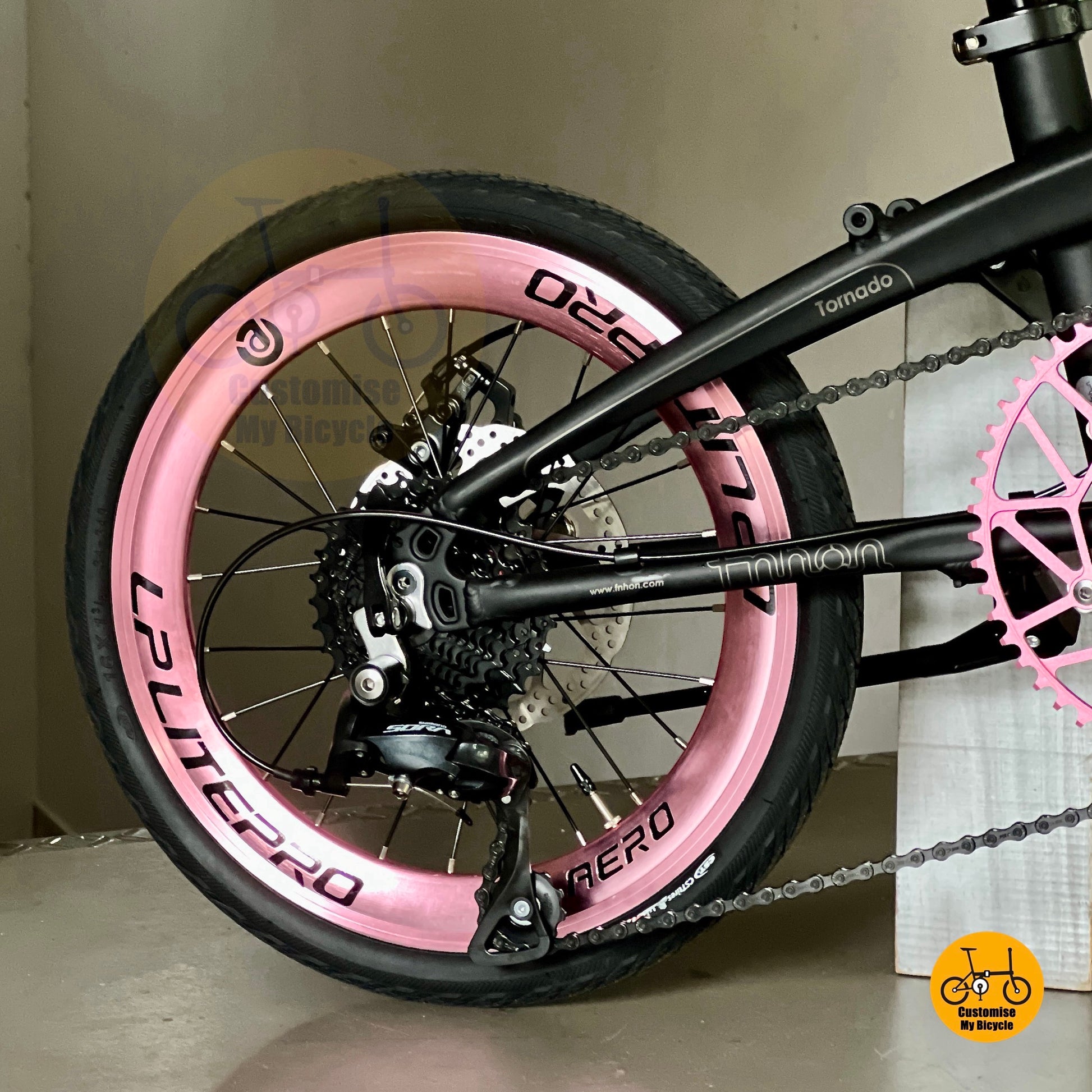 Rear angled view showing Shimano 9 speed drivetrain and cassette of Fnhon mini-Tornado 18" matte black
