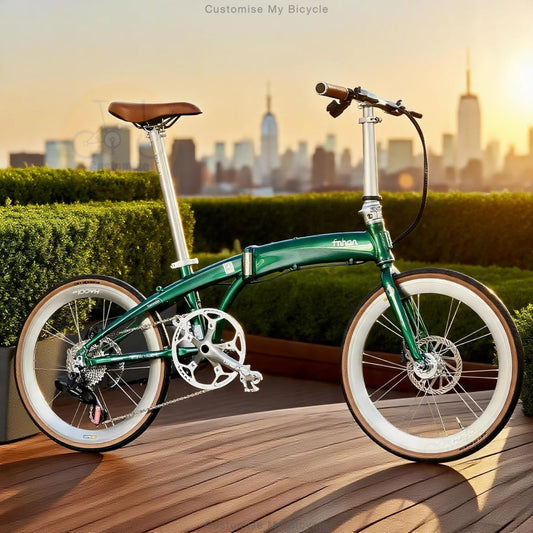 A green folding bicycle with white-wall tires and a brown saddle is parked on a wooden deck with a city skyline and hedges in the background. The brand name 'fzrns' is visible on the frame.