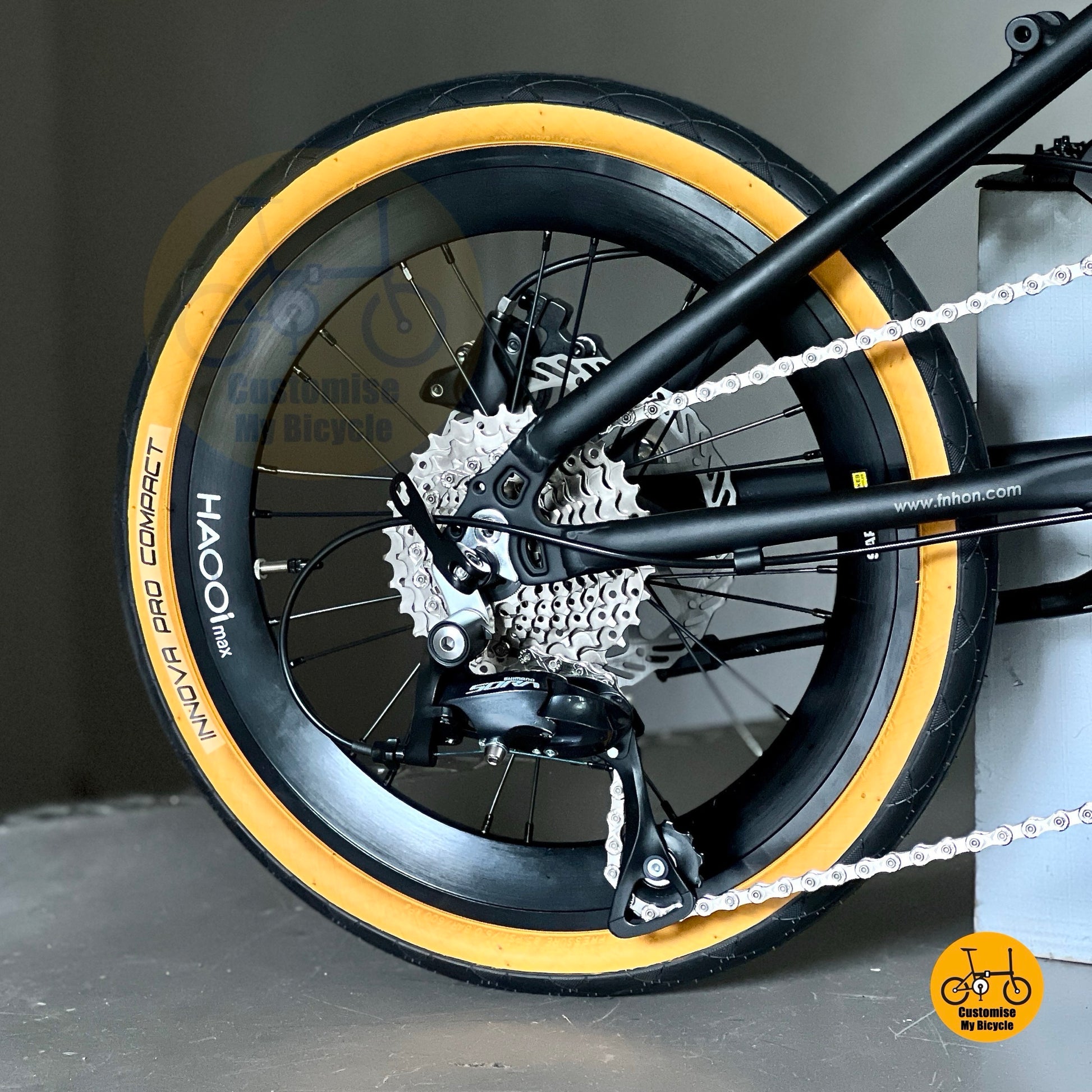 Close up Shimano 9 gears shifting drivetrain on Fnhon Monsoon Mini folding bike
