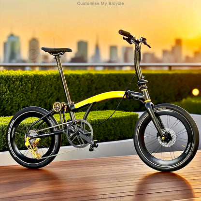 A folding bicycle with a black frame and bright yellow handlebar bar-end, photographed outdoors on a wooden deck with a blurred city skyline and hedges in the background at sunset.